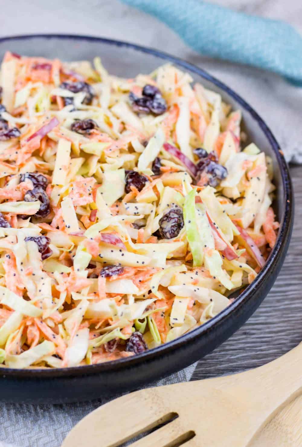 Apple Cranberry Coleslaw salad with creamy Greek yogurt dressing is a perfectly refreshing, crunchy side dish that can be served with just about anything, from pulled pork sandwiches to fried fish, or a nice juicy burger.