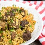Instant Pot Brown Rice Pilaf recipe is an easy to make version of a classic Beef Plov. With perfectly cooked rice and tender and juicy beef tips, it is a great All-in-One-Pot comfort meal!