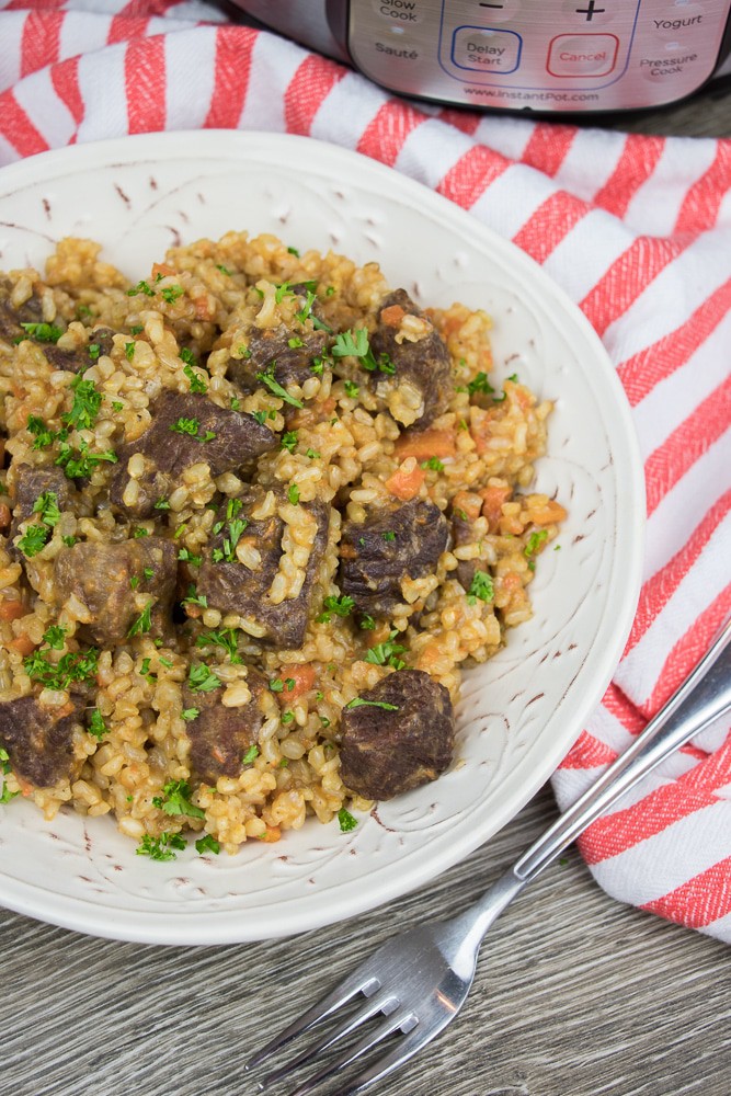 Instant Pot Brown Rice Pilaf recipe is an easy to make version of a classic Beef Plov. With perfectly cooked rice and tender and juicy beef tips, it is a great All-in-One-Pot comfort meal!