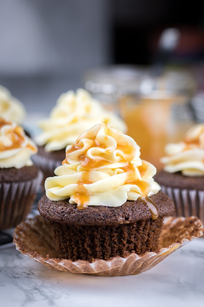 Chocolate Cupcakes with Caramel Filling and Vanilla Buttercream Frosting are moist and decadent mini cakes that you can make from scratch.