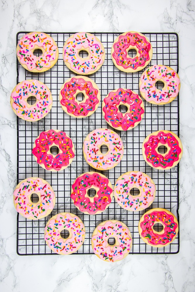 Donut Sugar Cookies topped with icing and sprinkles are the best recipe for soft cut out sugar cookies made from scratch!