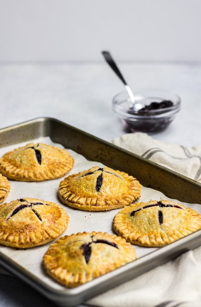 Mini Blueberry Hand Pies made with pie crust and homemade blueberry jam is a perfect treat for breakfast or dessert. 