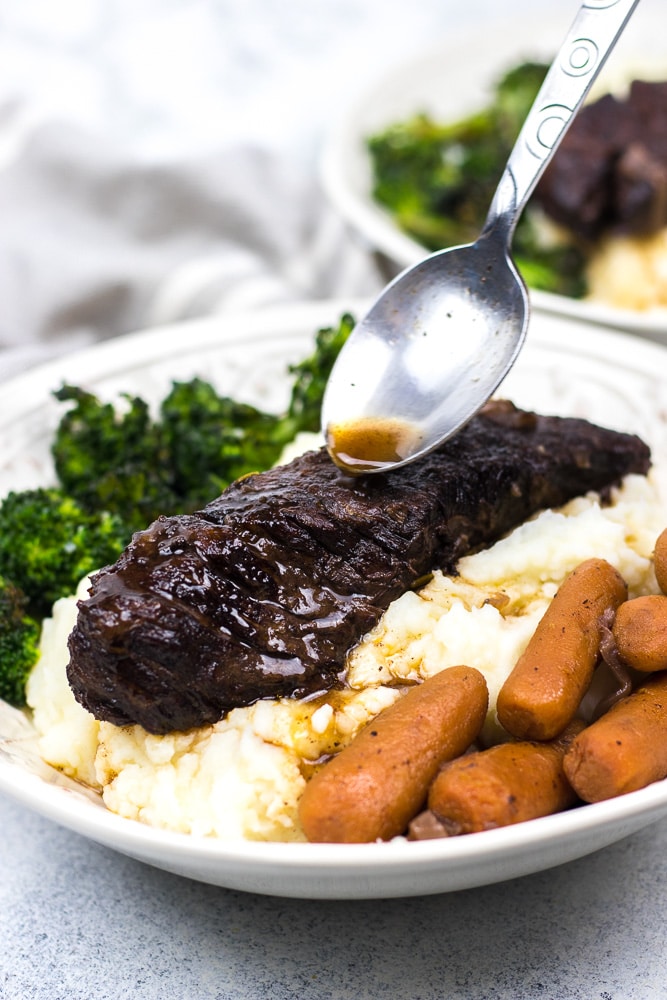 Instant Pot Short Ribs is the best and super easy recipe for juicy and tender boneless short ribs braised in red wine and cooked in your favorite pressure cooker!