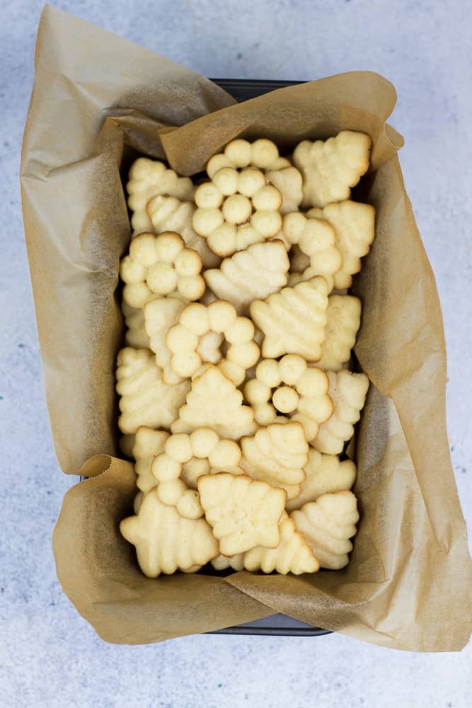 Almond Spritz Cookies in a cookie tray.