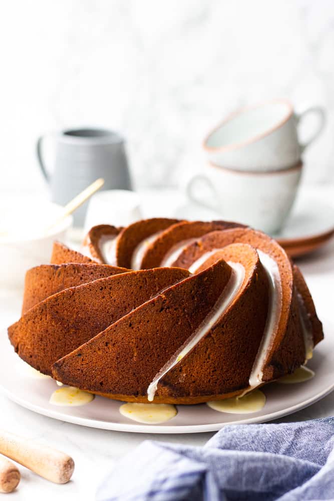 Orange Pound Cake on a light grey plate.