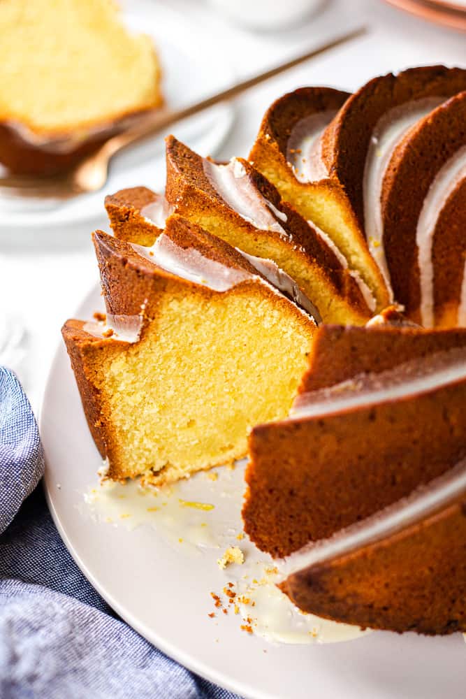 Orange Pound Cake cut in slices on a light grey plate.