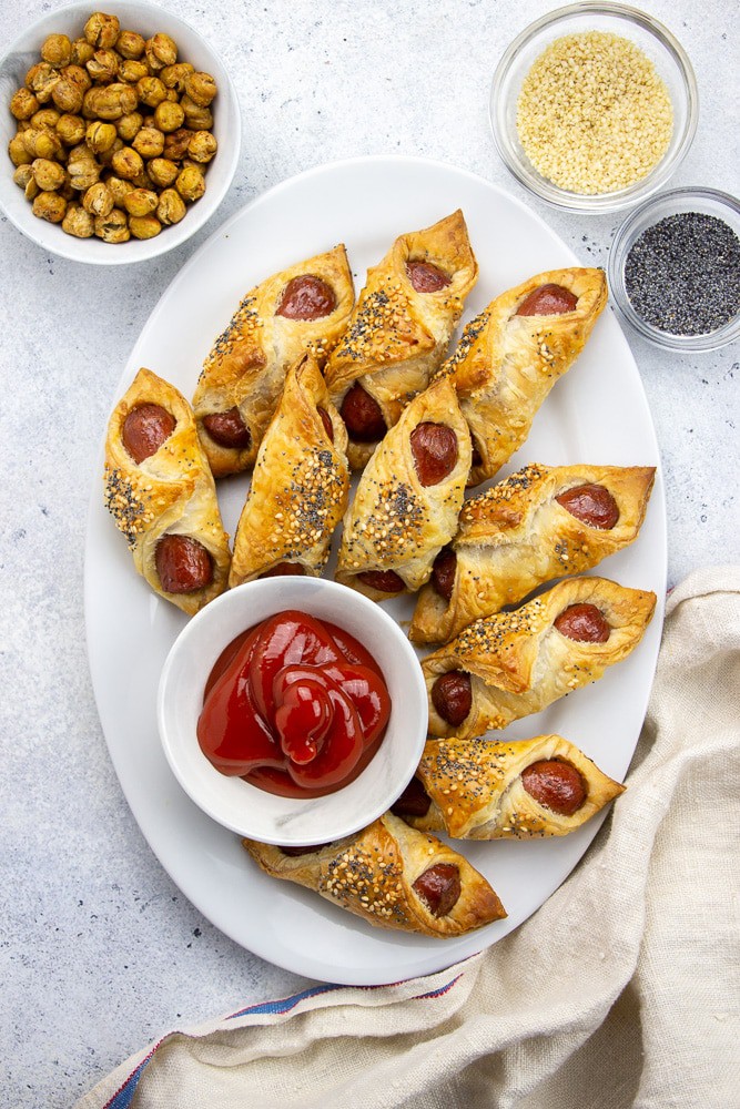 Pigs in a Blanket is the best easy appetizer for a party. Made just with 2 main ingredients, puff pastry and hot dogs, it will be a great treat for a crowd!