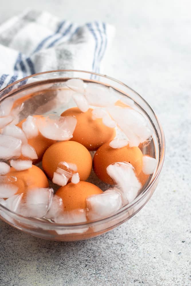 Instant Pot Hard Boiled Eggs, in a bowls with water and ice.