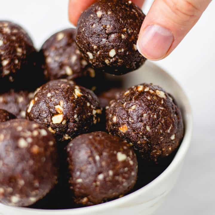 Brownie bites in a white bowl.