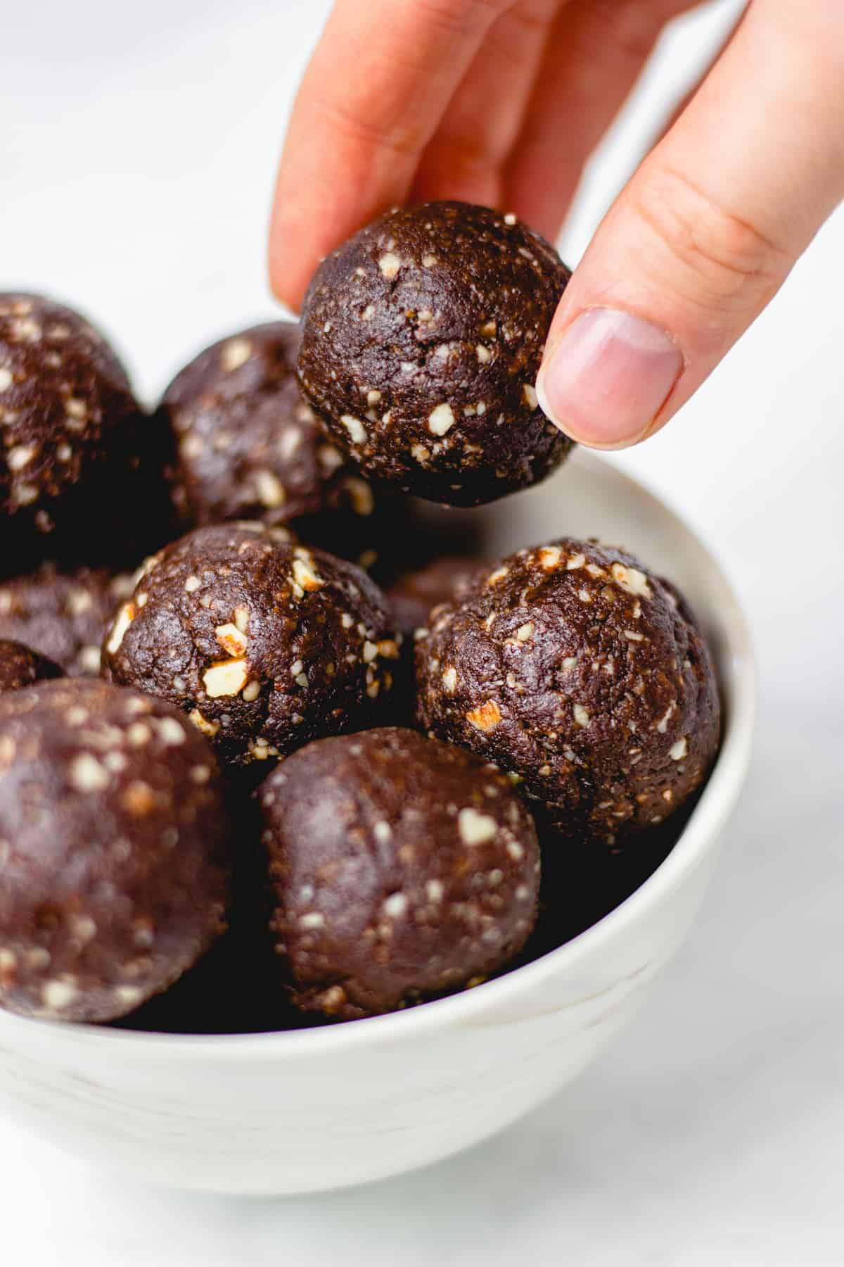 Brownie bites in a white bowl.