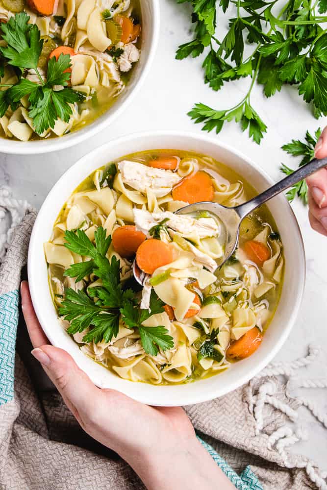 Chicken Noodle Soup in a white bowl.