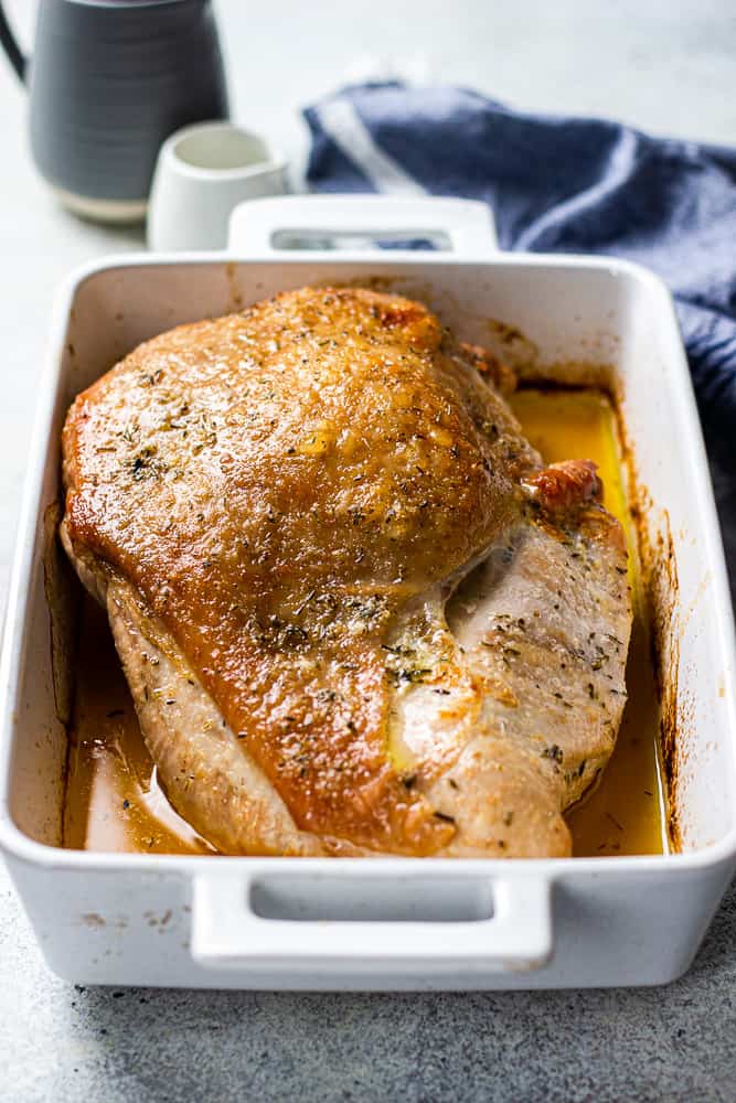 Oven Roasted Turkey Breast in a white baking pan.