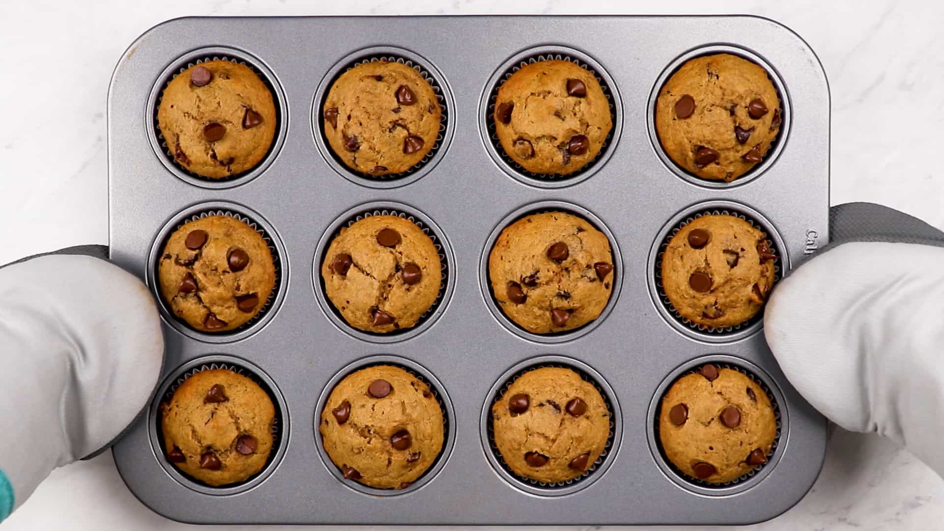 Baked Healthy Banana Chocolate Chip Muffins in a baking pan.