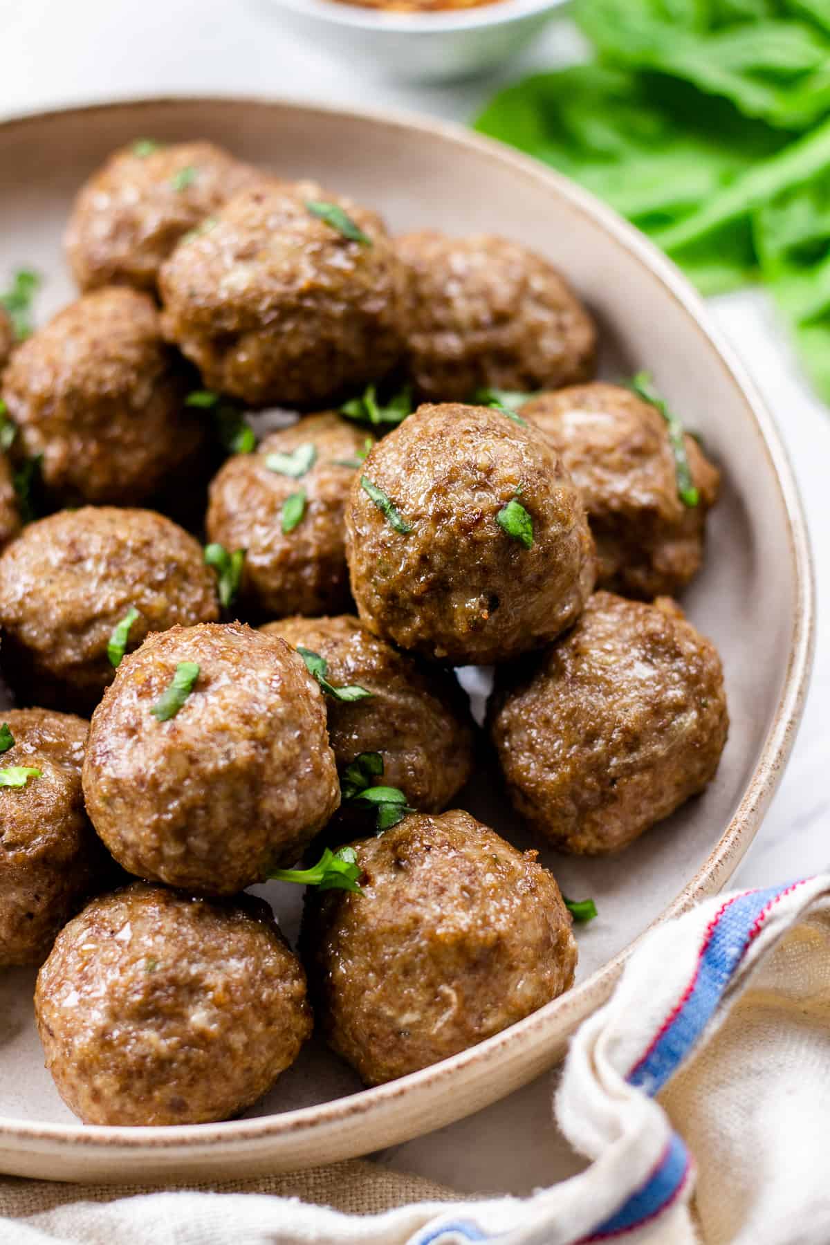Cooked meatballs served on a plate.