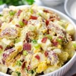Potato Salad with Bacon and Egg in a white bowl.