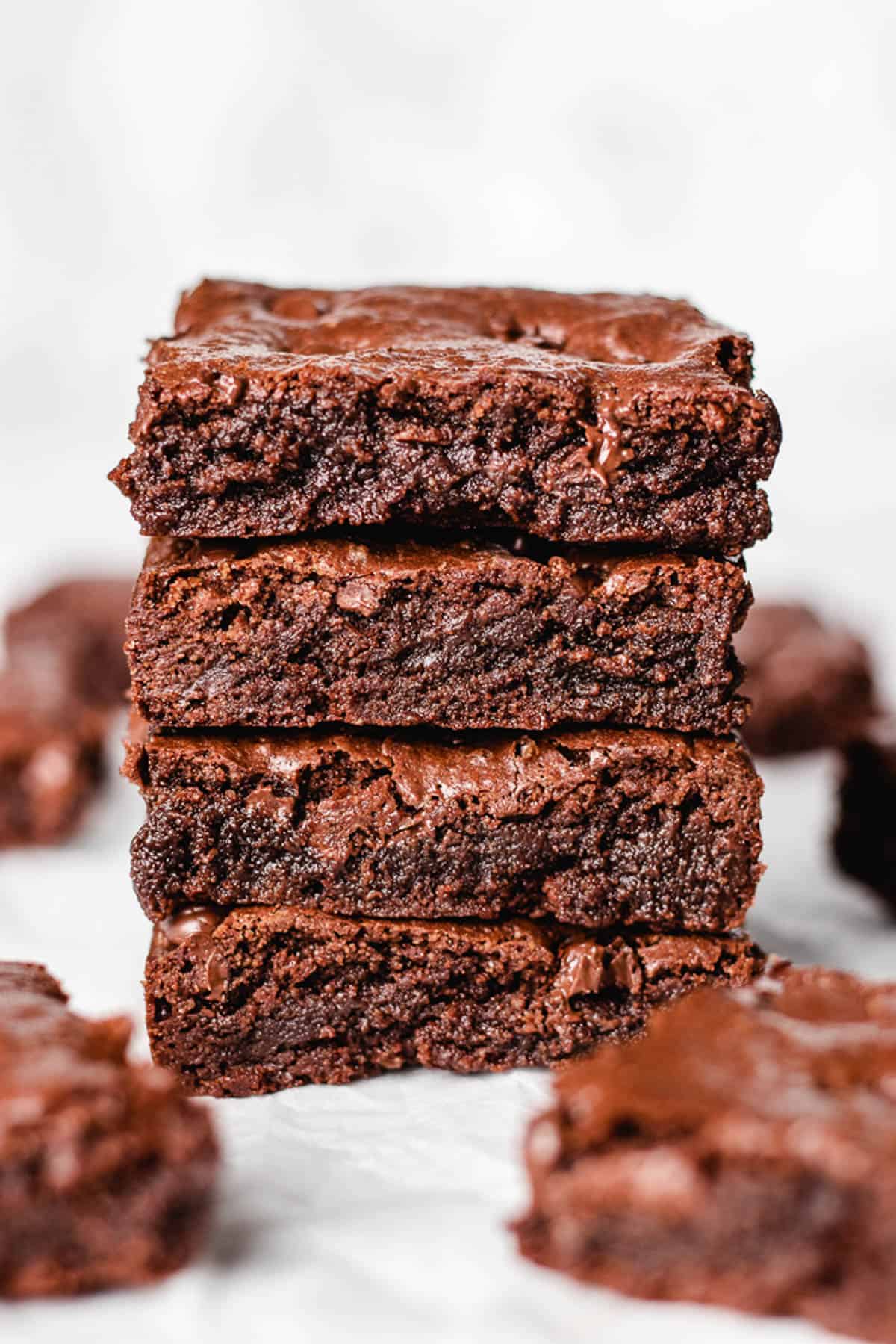 Squares of brownie on top of each other.