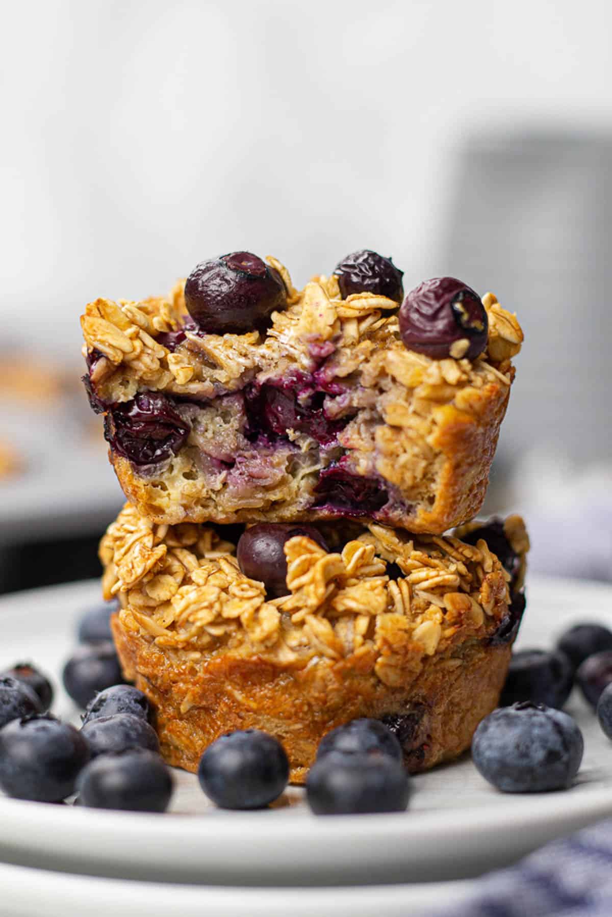 Oatmeal cups with blueberries on a plate.