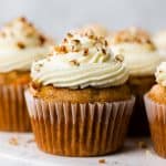 Carrot Cake Cupcakes topped with Cream Cheese Frosting on a serving platter.