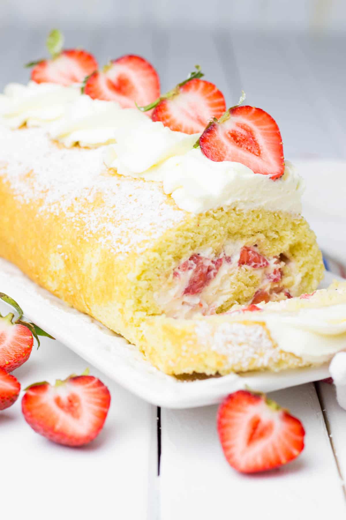 Cake roll filled with whipped cream and fresh strawberries.