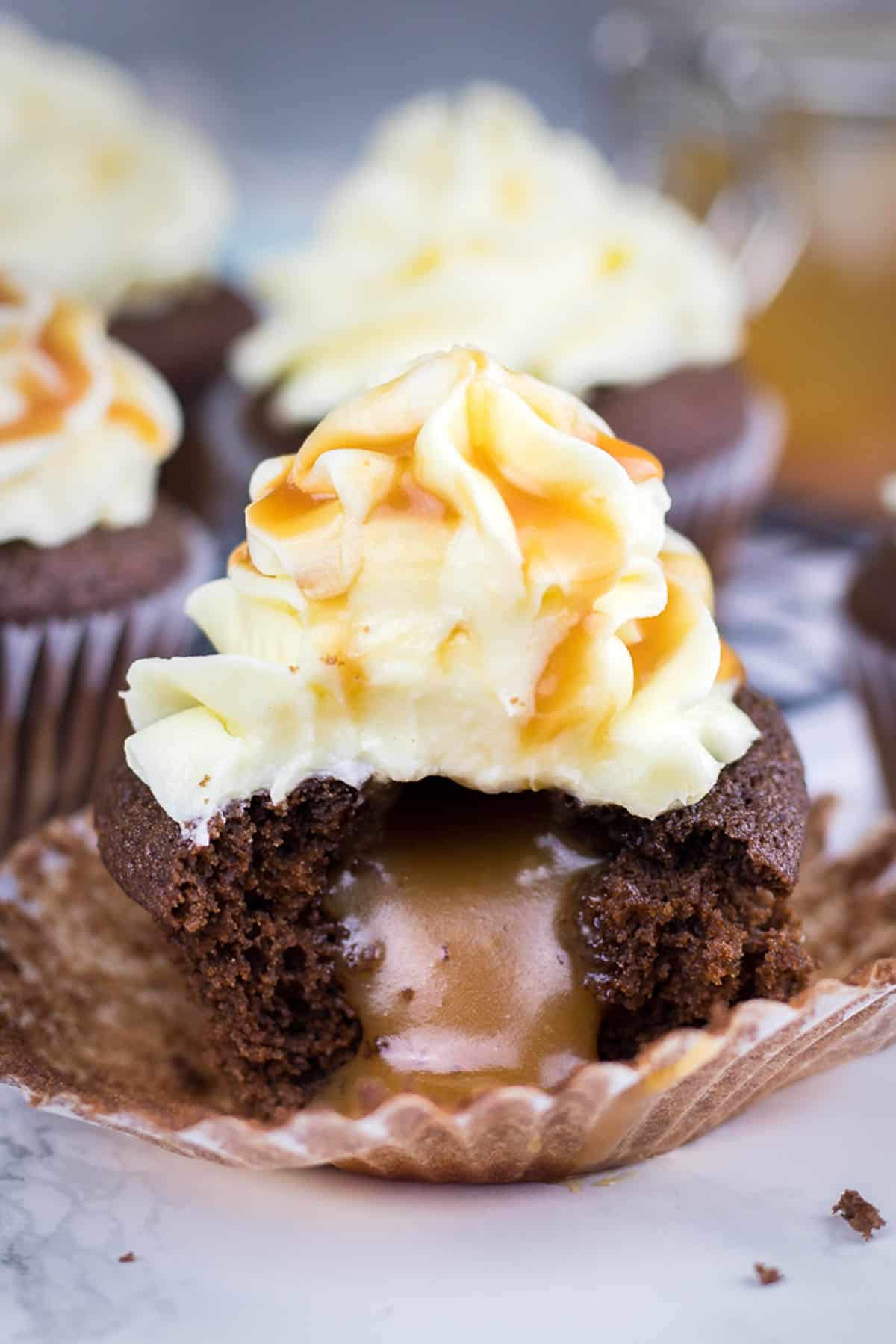 A bite shot od chocolate cupcakes with caramel filling.