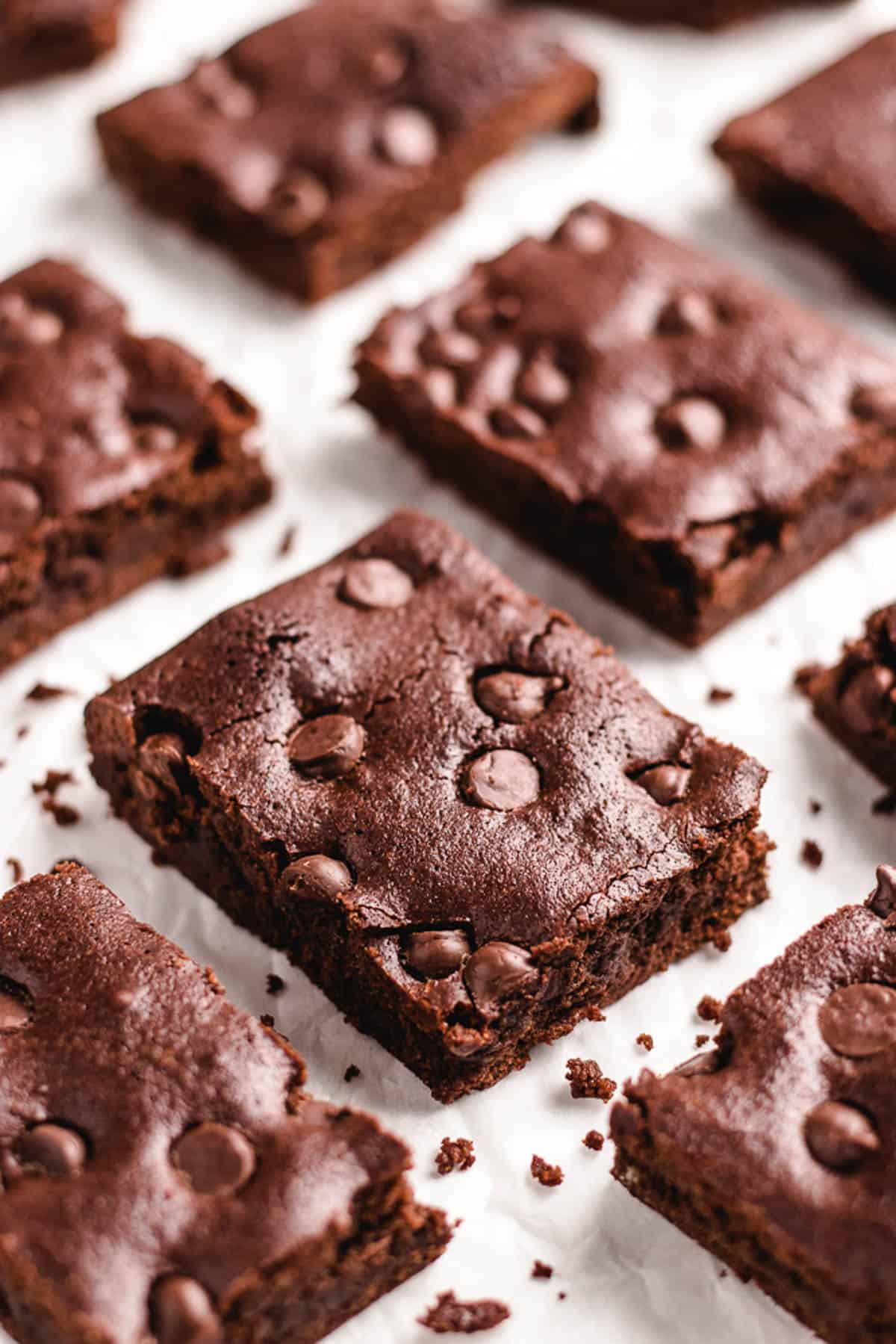 Sliced brownie, topped with chocolate chips.