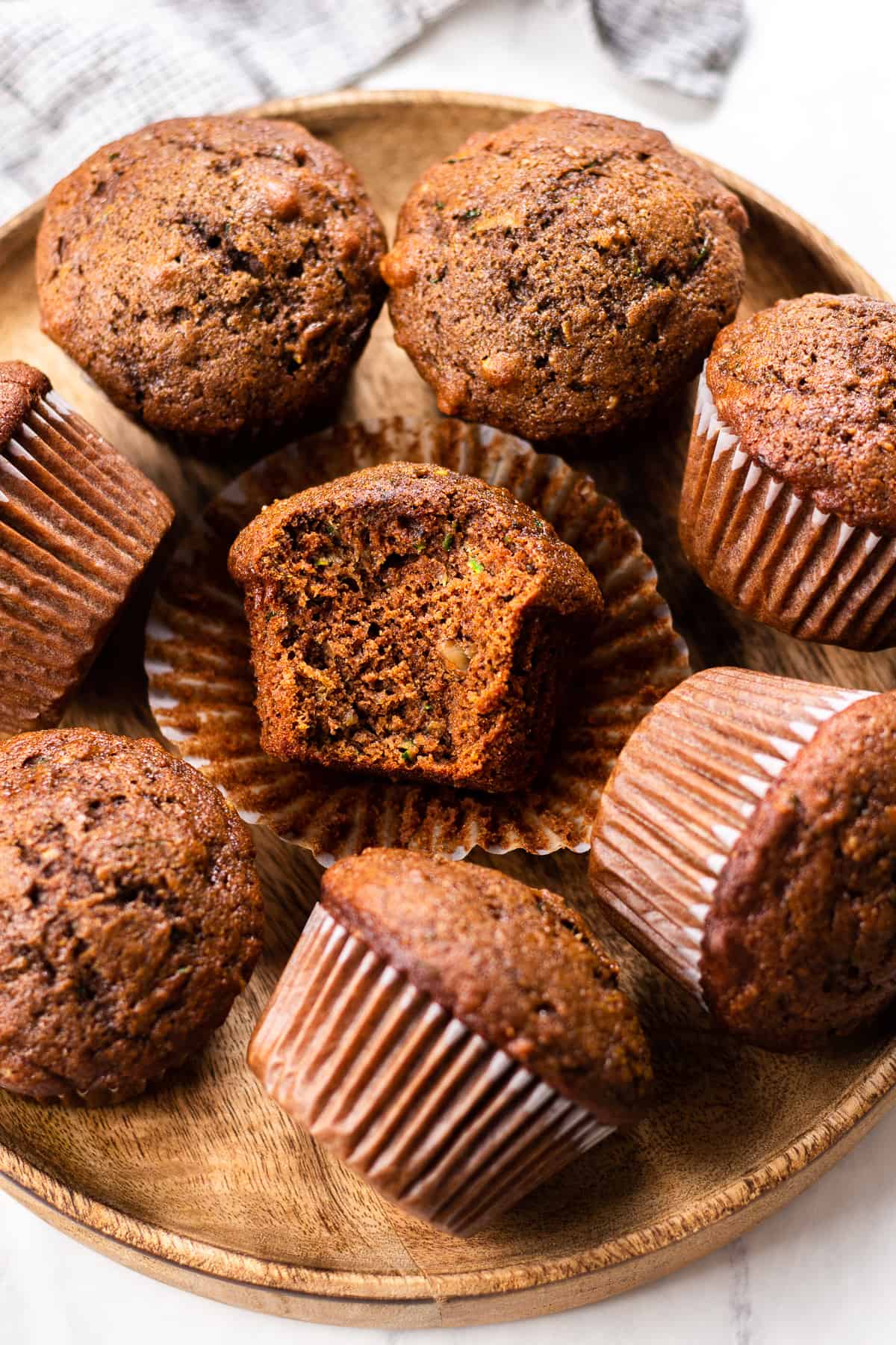 Chocolate Muffins on a wooden plate.
