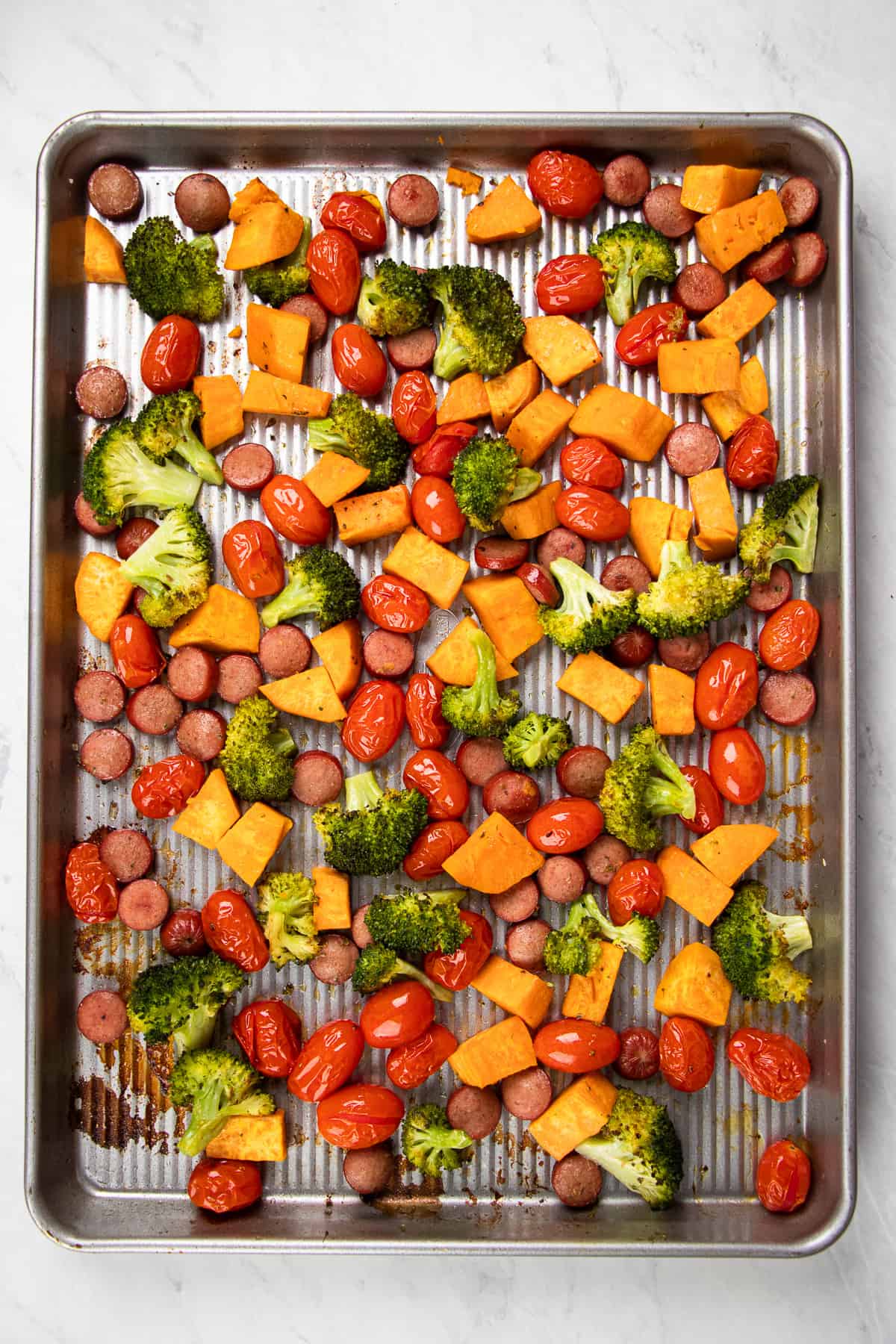 Roasted vegetables on a sheet pan.