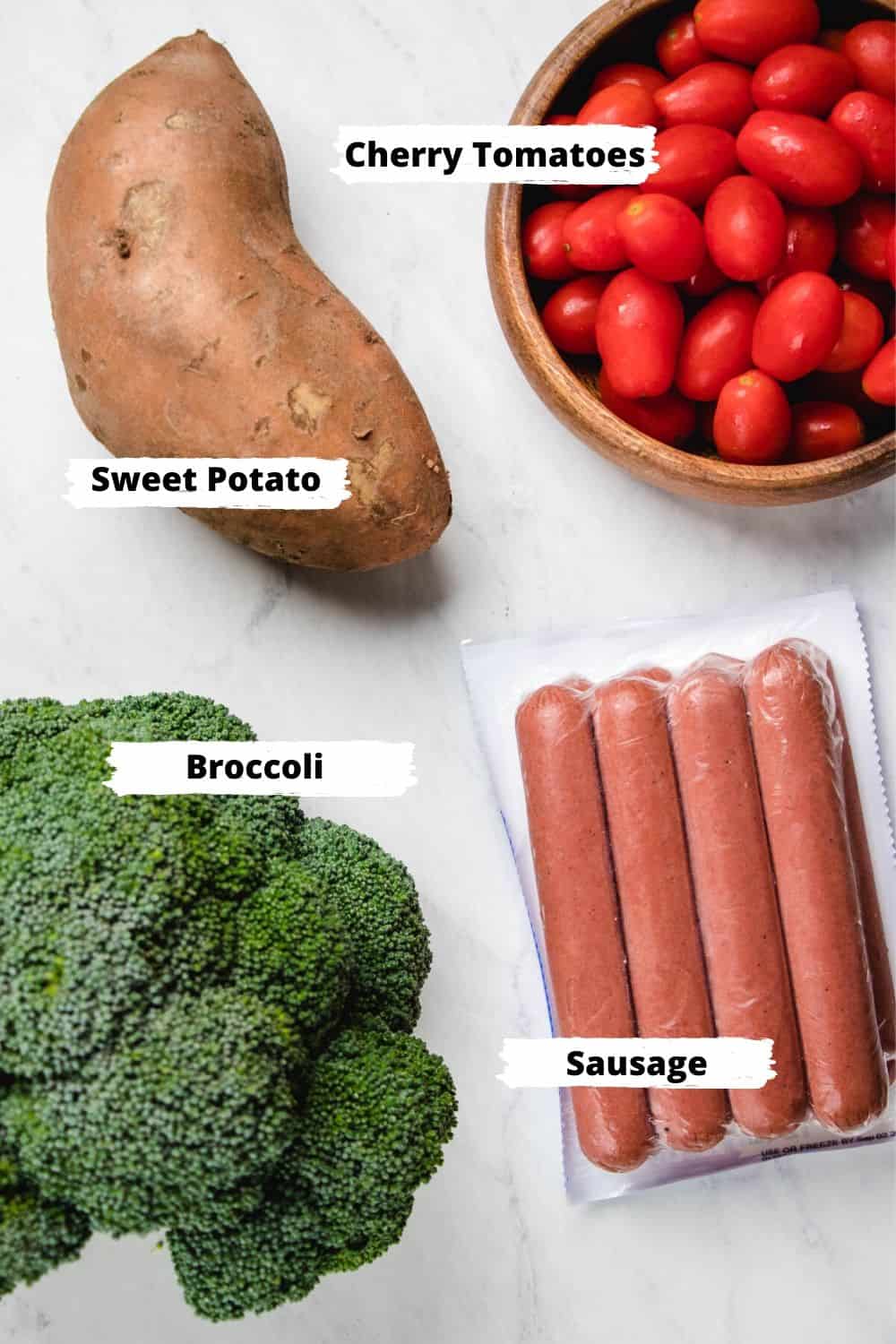 Ingredients for roasted sausage and veggies: sweet potato, cherry tomatoes, broccoli, and sausages.