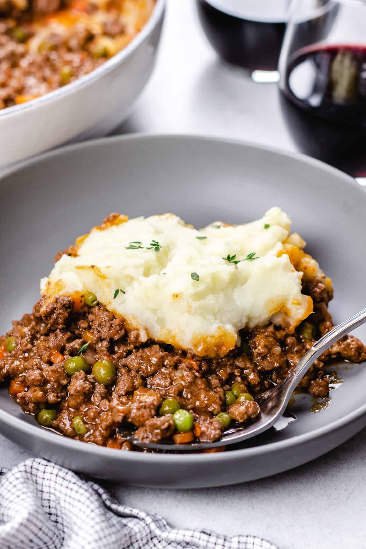 Shepherd's Pie with a fork in a grey bowl.