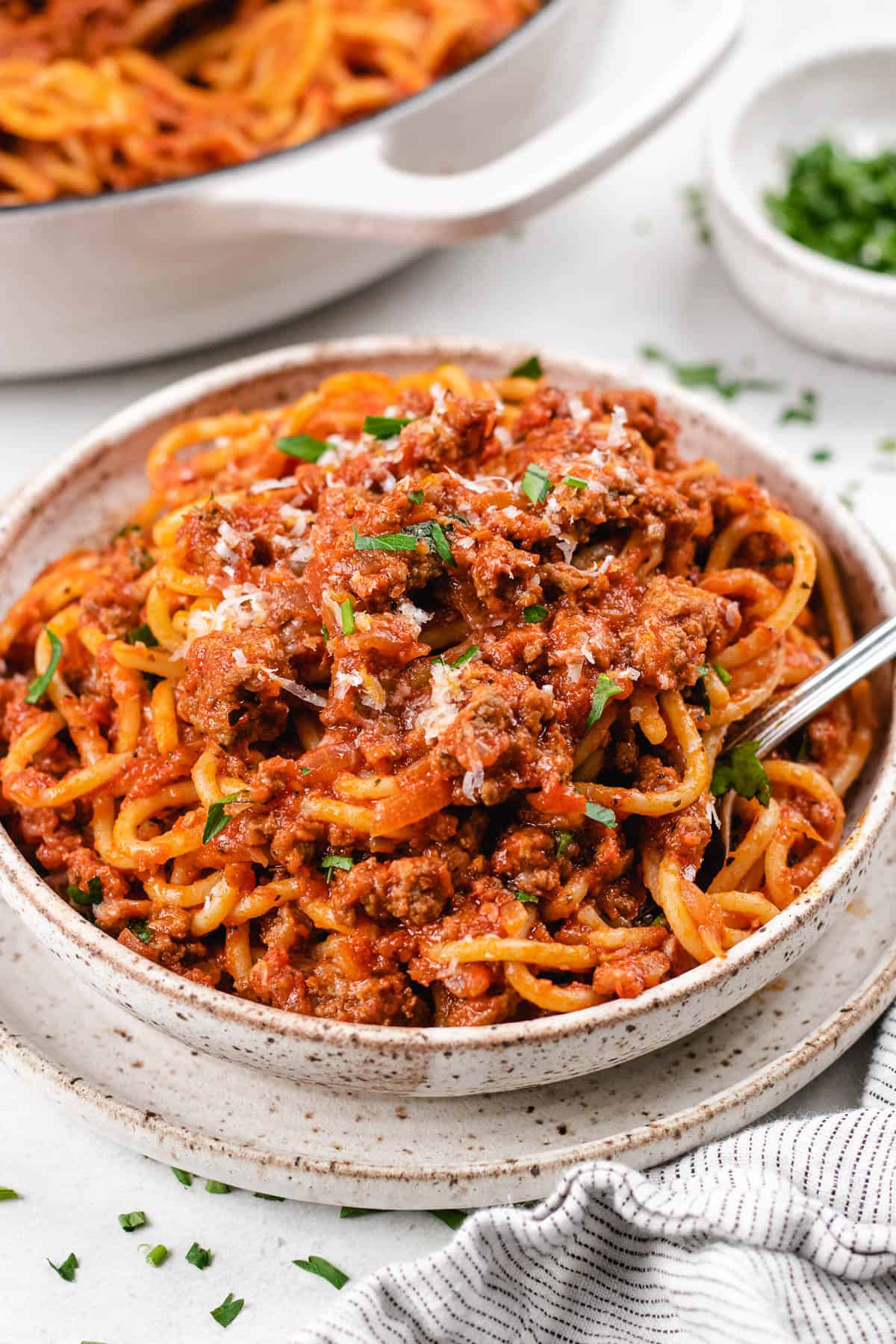 Spaghetti Bolognese in a bowl with a fork.