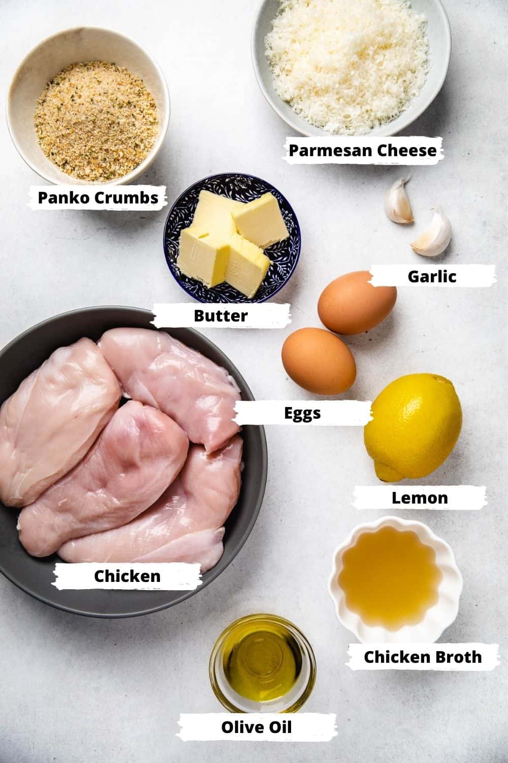 Ingredients for Lemon Chicken on a white table.