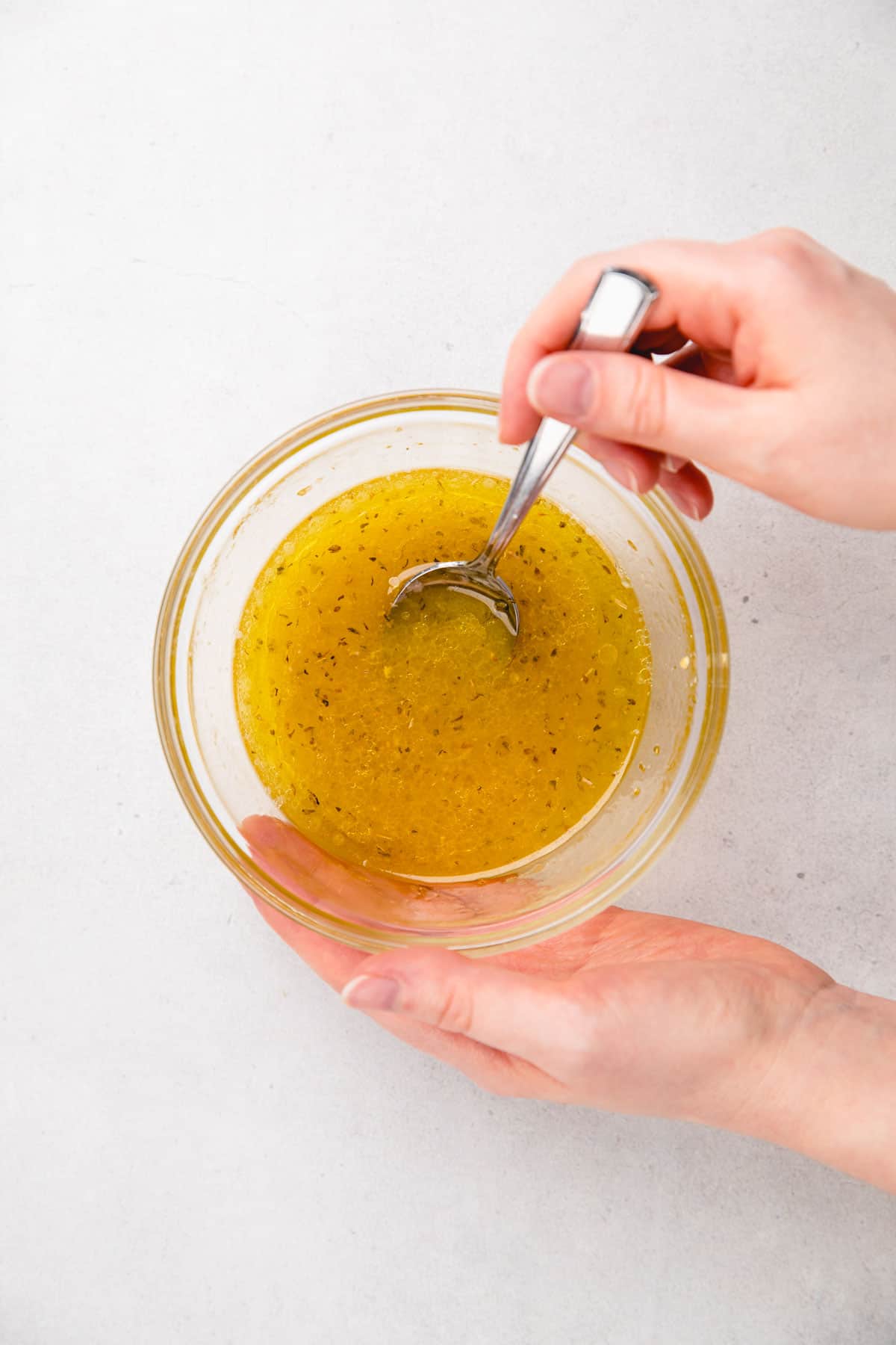 mixing vinaigrette in a small mixing bowl.