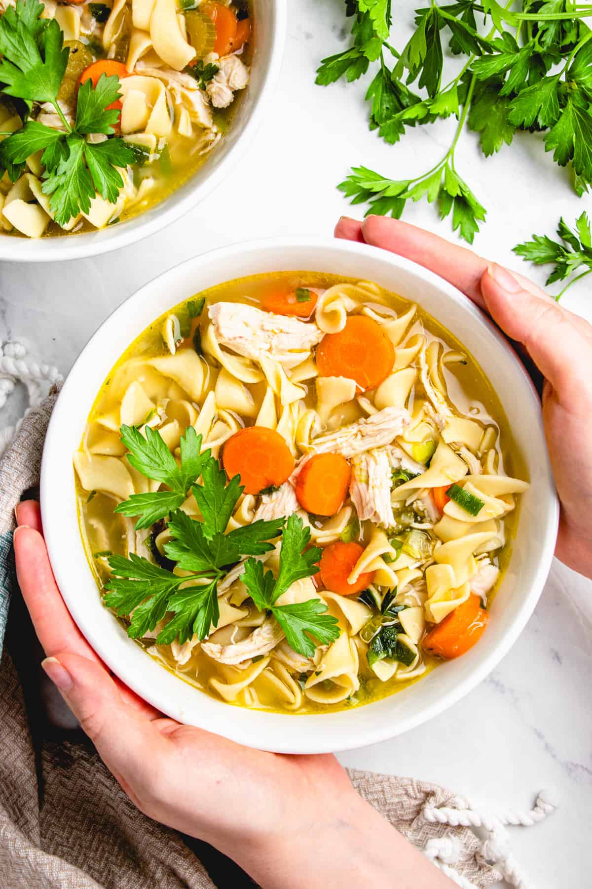 Chicken Noodle Soup in a white bowl.