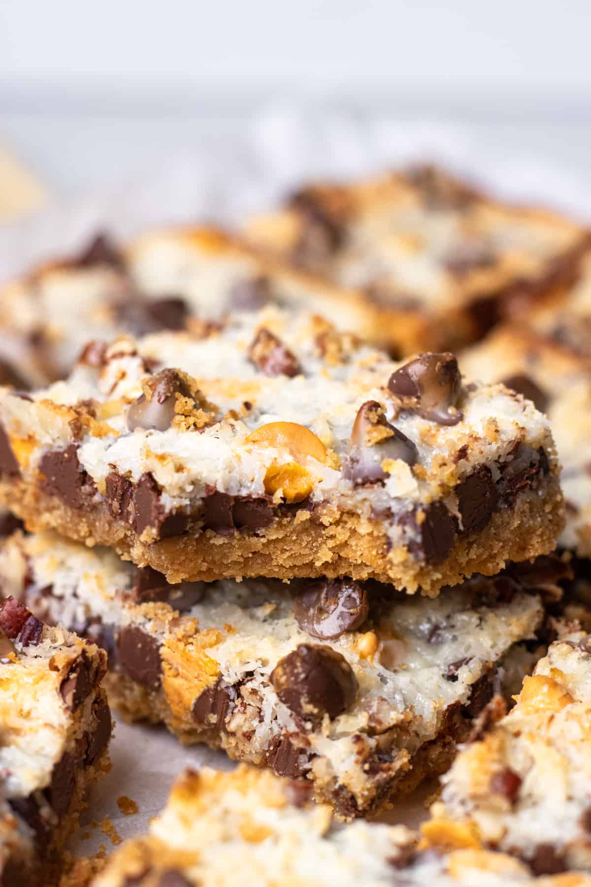 Hello Dolly cookie bars on top of each other.