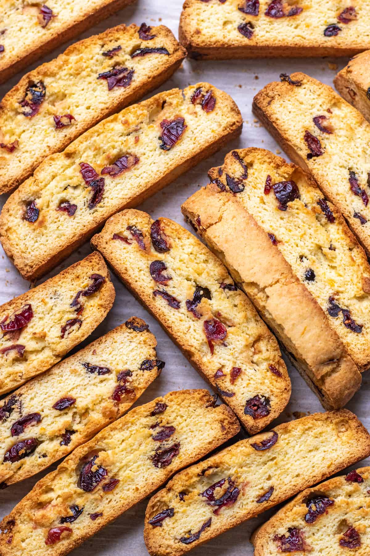 Orange Cranberry Biscotti on a baking sheet with parchment paper.
