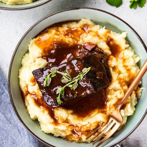 Bone in short rib with mashed potatoes, topped with red wine gravy.