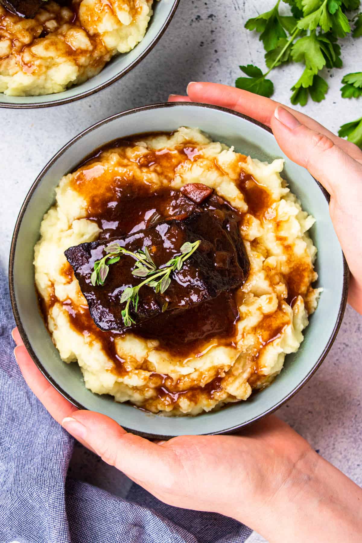 Bone in short rib with mashed potatoes, topped with red wine gravy.