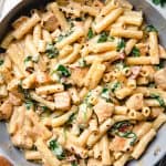 Pasta with chicken, sun dried tomatoes, and spinach in creamy sauce.