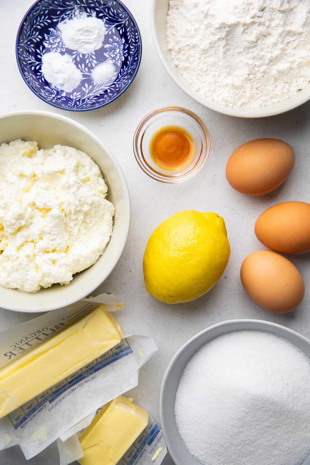 Ingredients for Italian Lemon Ricotta cake in separate bowls.
