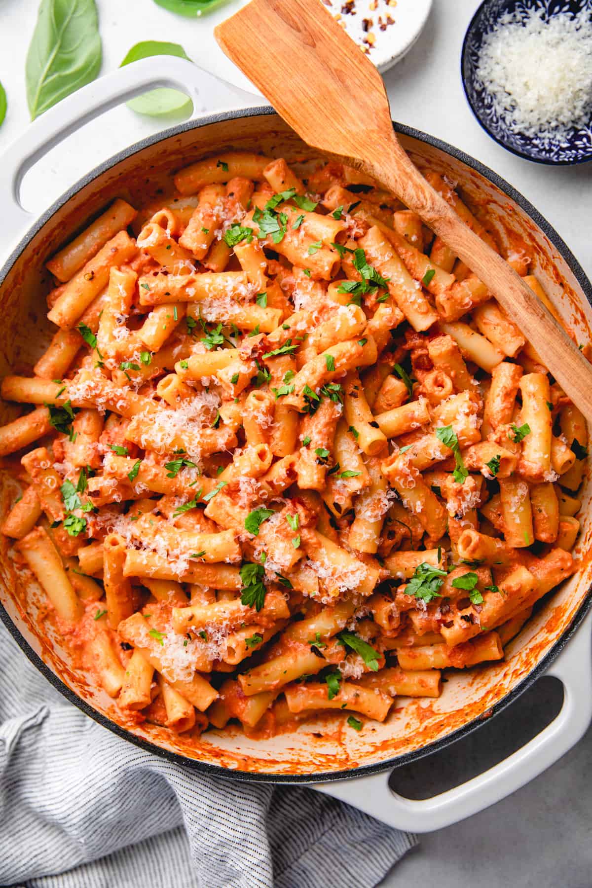 Pasta, coated in pink sauce, in a skillet.