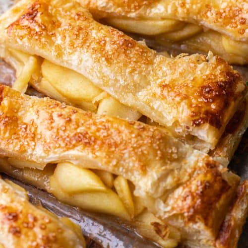Sliced puf pastry pie, filled with caramelized apple slices.