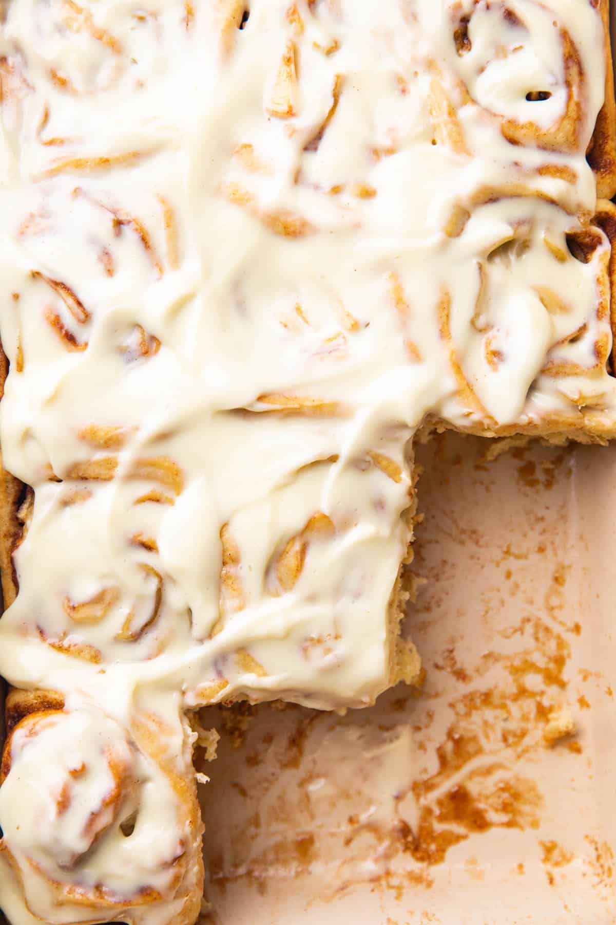 Apple Pie Cinnamon Rolls topped with cream cheese frosting.