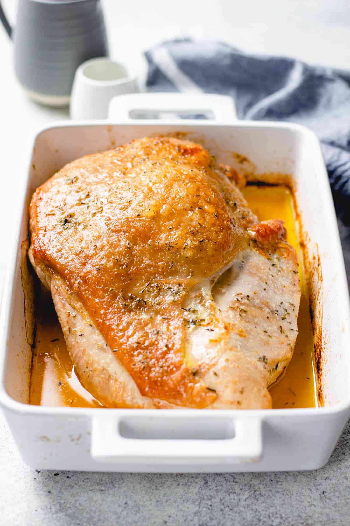 Roasted turkey breast in a baking pan.