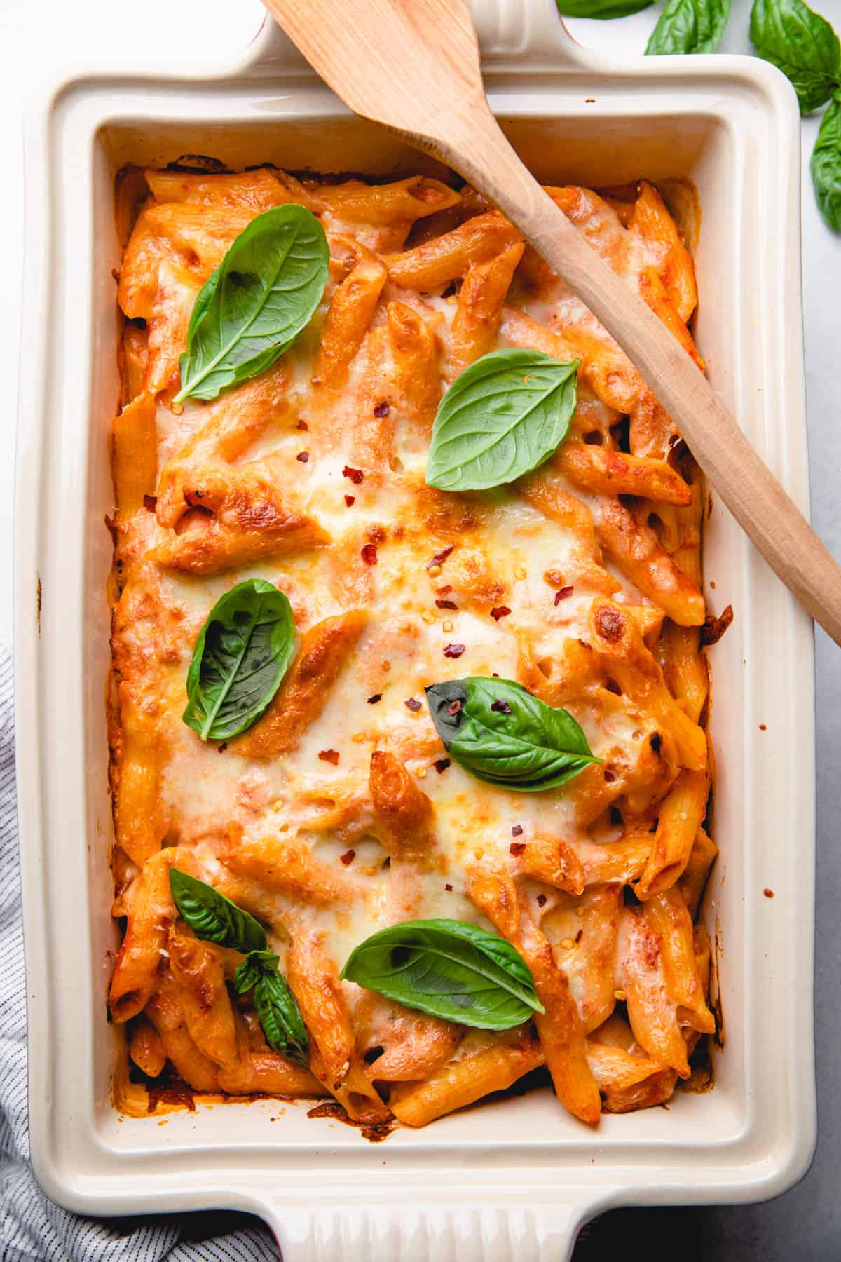 Pasta in a creamy tomato sauce, topped with melted cheese.
