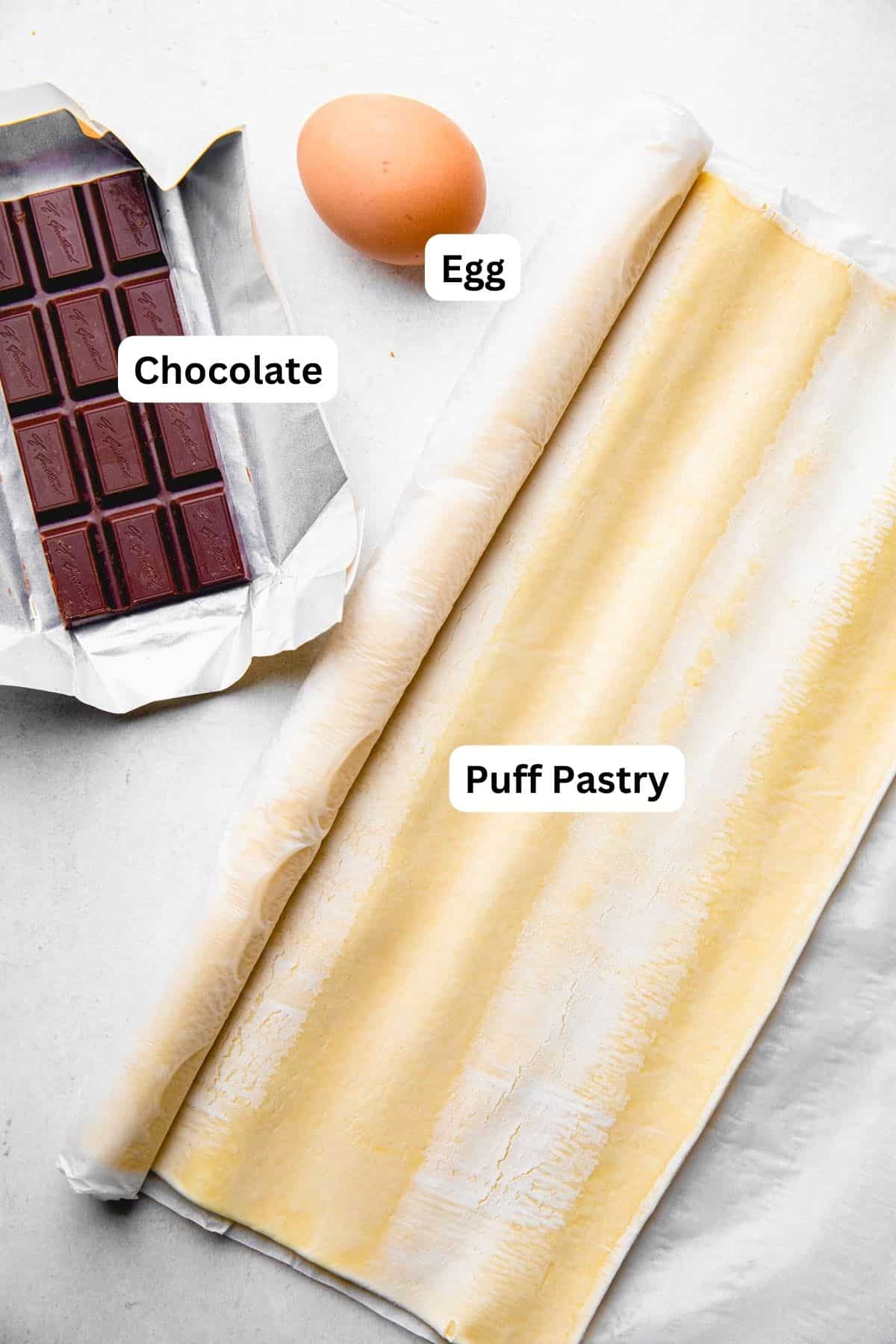 Puff pastry, baking chocolate, and an egg.