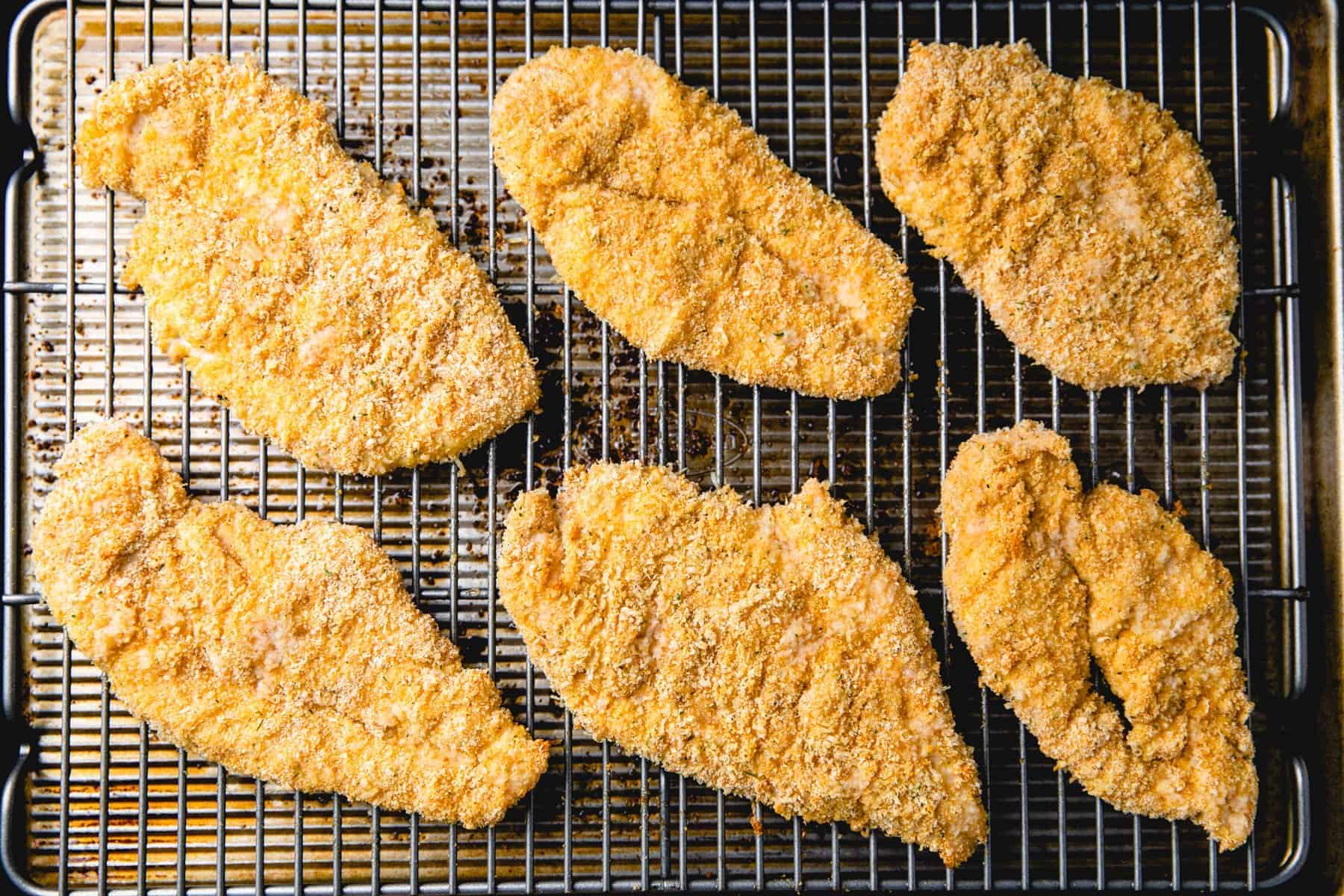 Baked Chicken Cutlets on a bakich sheet.
