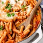 Cheesy baked ziti in a skillet.