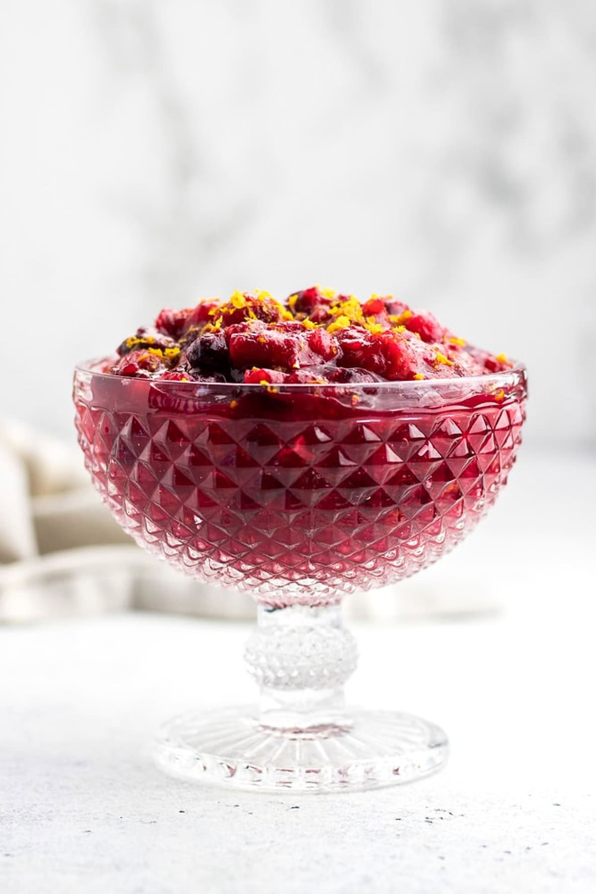 Cranberry sauce in a glass bowl.